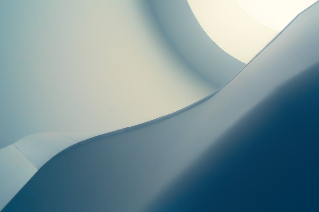 services-05 Sophisticated minimalist abstract with smooth blue curves and geometric design, perfect for a modern background.